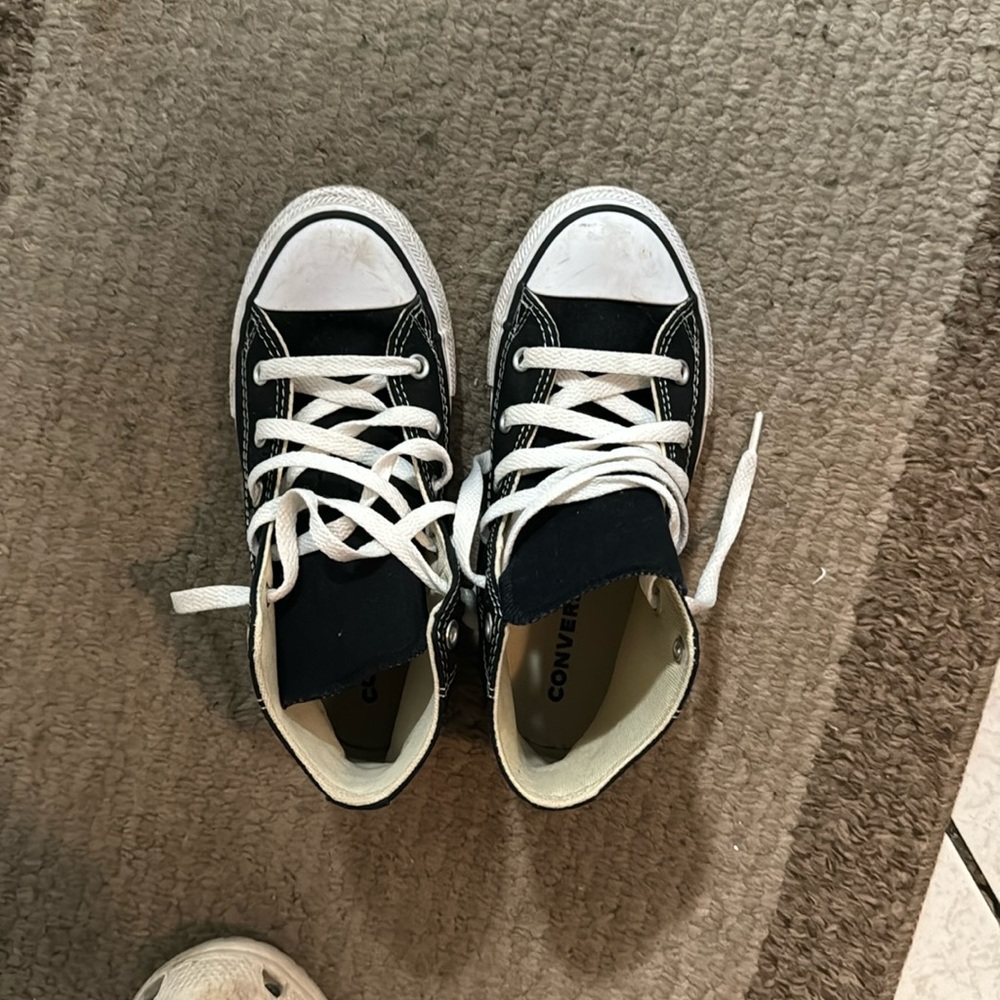 Black and white high top converse